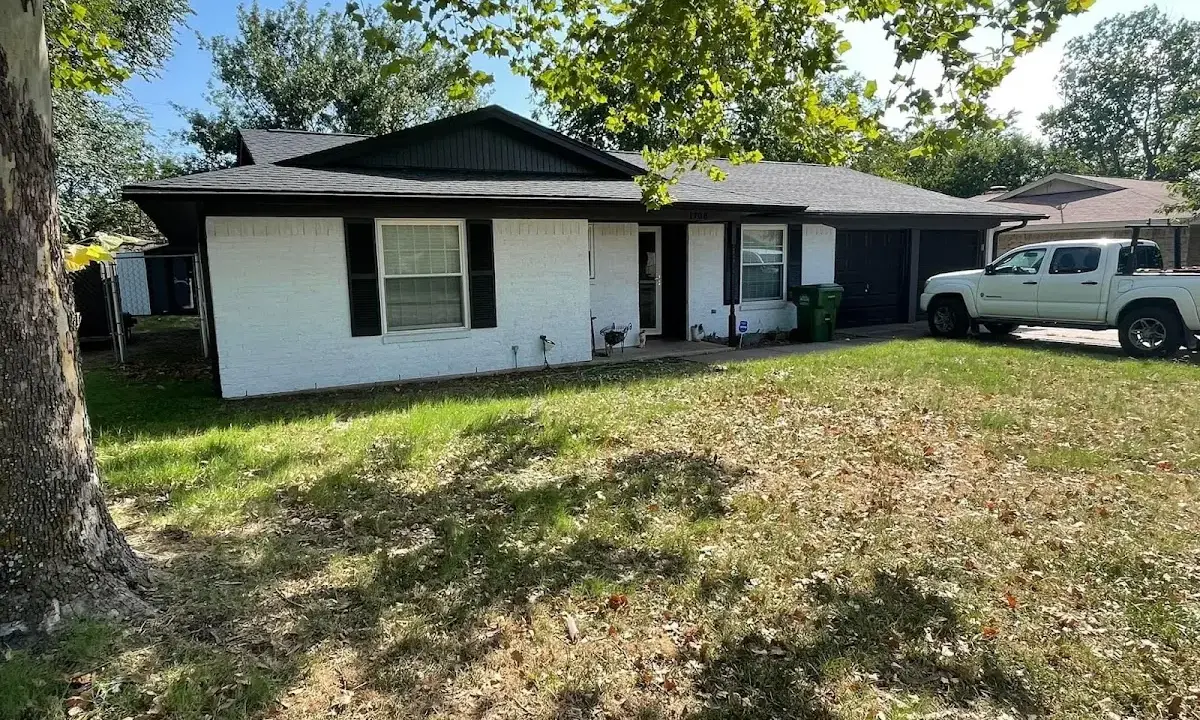 Professional roofing crew working on a residential roof in Calimesa